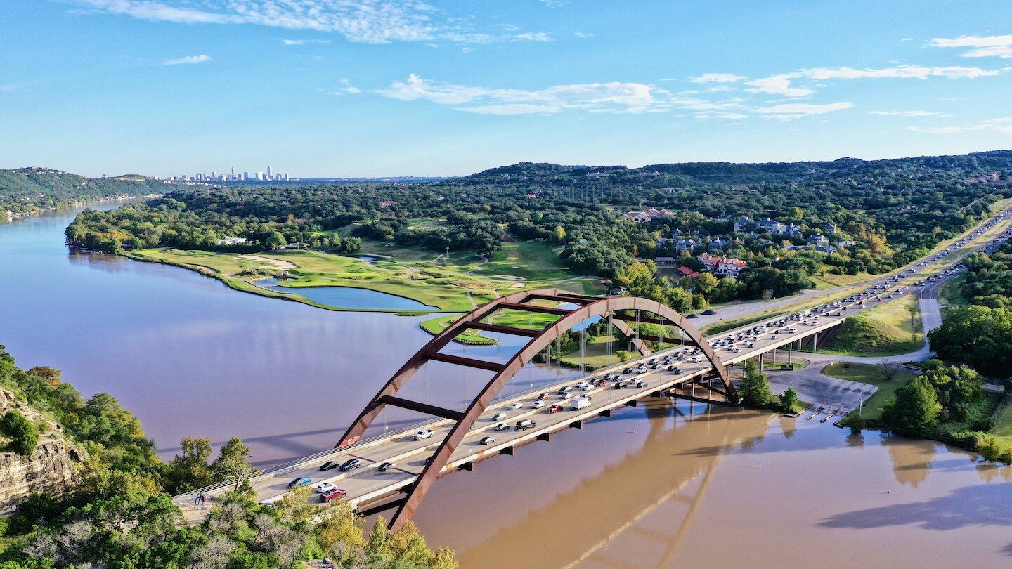 Pennybacker bridge with view of Austin skyline in background