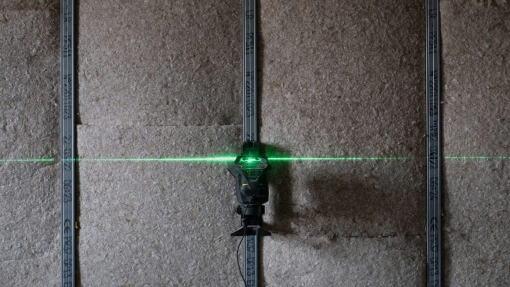 insulation laser guide in wood house frame